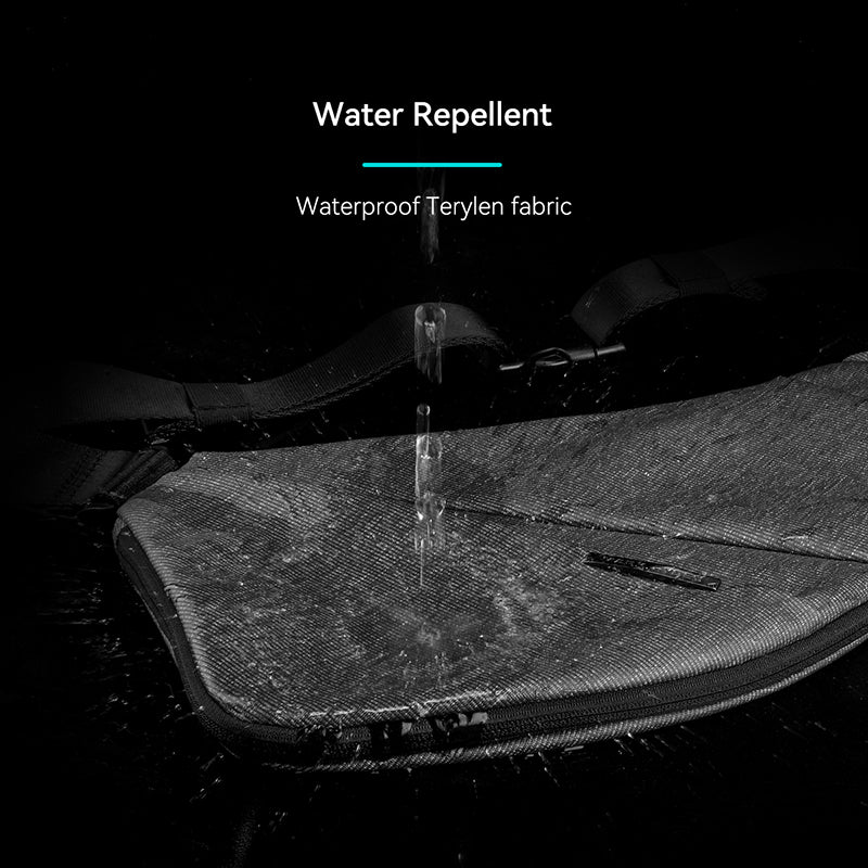 Gray ChestFlex modern urban chest bag with water beading off its waterproof Terylen fabric, demonstrating water repellent feature.