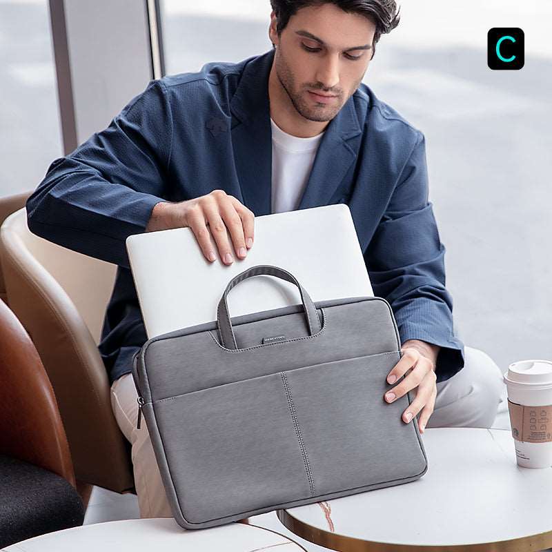 Official Mark Ryden gray anti-theft business laptop bag holding 13.3-15.6 inch laptop in cafe