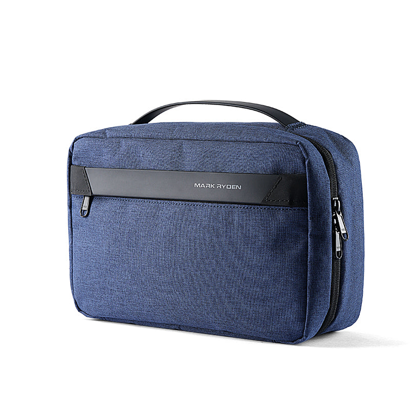 Blue compact multi-layer paged washbag with large capacity by Mark Ryden, designed for travel, featuring a black handle and zippered compartments.