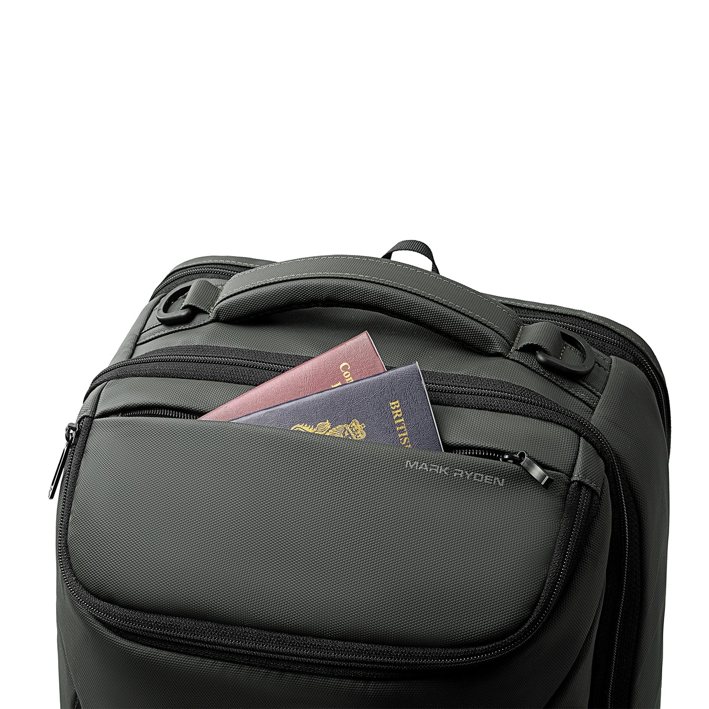 Dark gray Mark Ryden Compacto Pro backpack with front zip pocket holding two passports, featuring durable zippers and ergonomic handle.