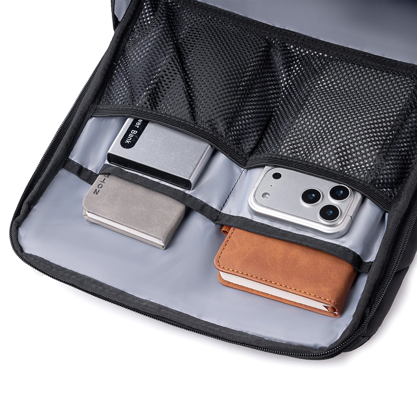 MarkRyden Compacto Pro daily backpack interior with mesh compartments holding power bank, phone, notebooks