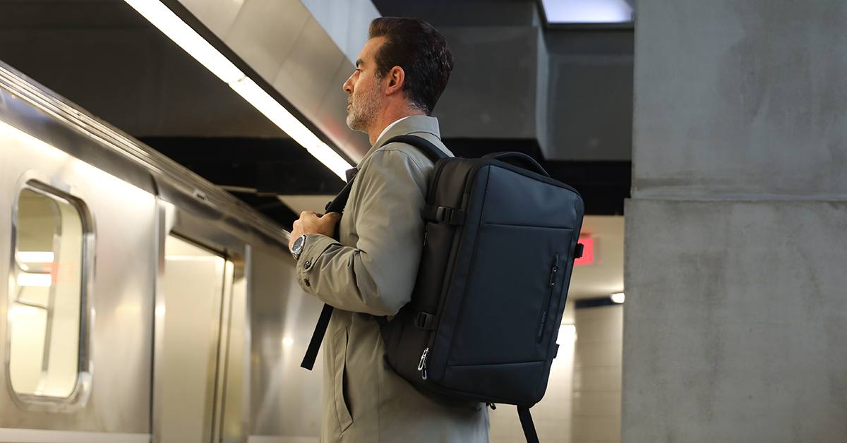 Man with black Mark Ryden anti-theft backpack at Munich subway station
