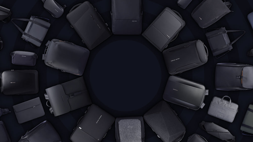 Circular display of MARK RYDEN Global's dark-toned bags and backpacks, including anti-theft and travel essentials, for the On Sale collection.