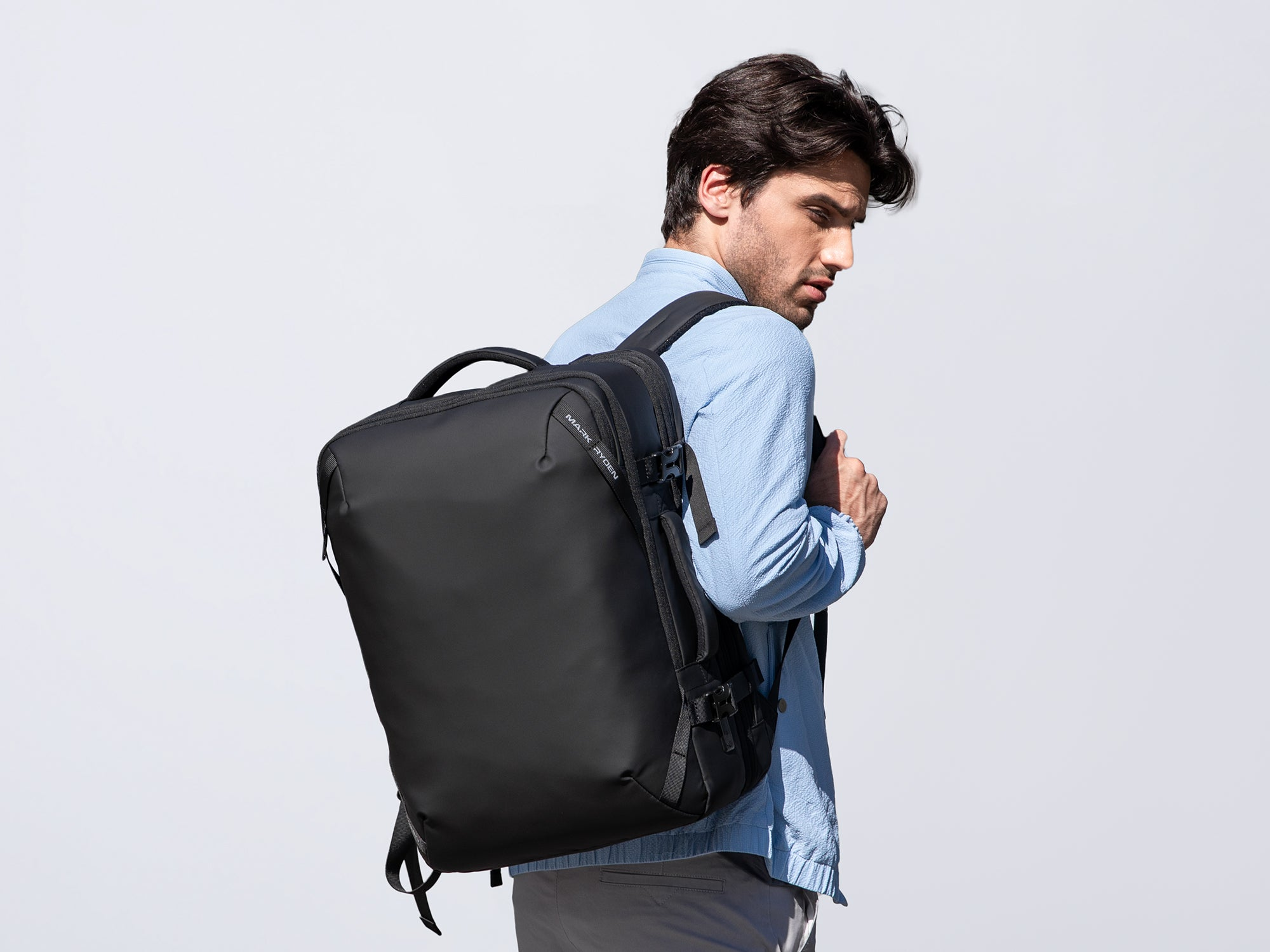 Mark Ryden black anti-theft travel backpack on model