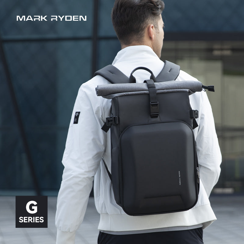 Man wearing Mark Ryden black large camera backpack G Series in urban environment