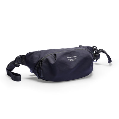 Navy blue Mark Ryden ChillFlex sling bag with zippered front pocket, adjustable crossbody strap, and minimalist design for everyday use.