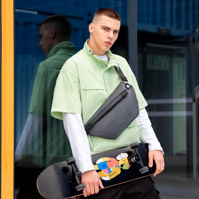 Pelmeen gray chest bag with streamlined design, textured material, ideal for daily urban travel, from Mark Ryden Global.