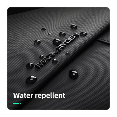 Black textured MARK RYDEN UrbanStride Compact City Explorer’s Satchel Crossbody Bag with water droplets demonstrating water repellent feature.