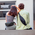 MarkRyden super lightweight daily crossbody bag on man in light green shirt, urban scene