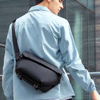 Mark Ryden Global Casual II black waterproof scratch-resistant stylish messenger bag on model
