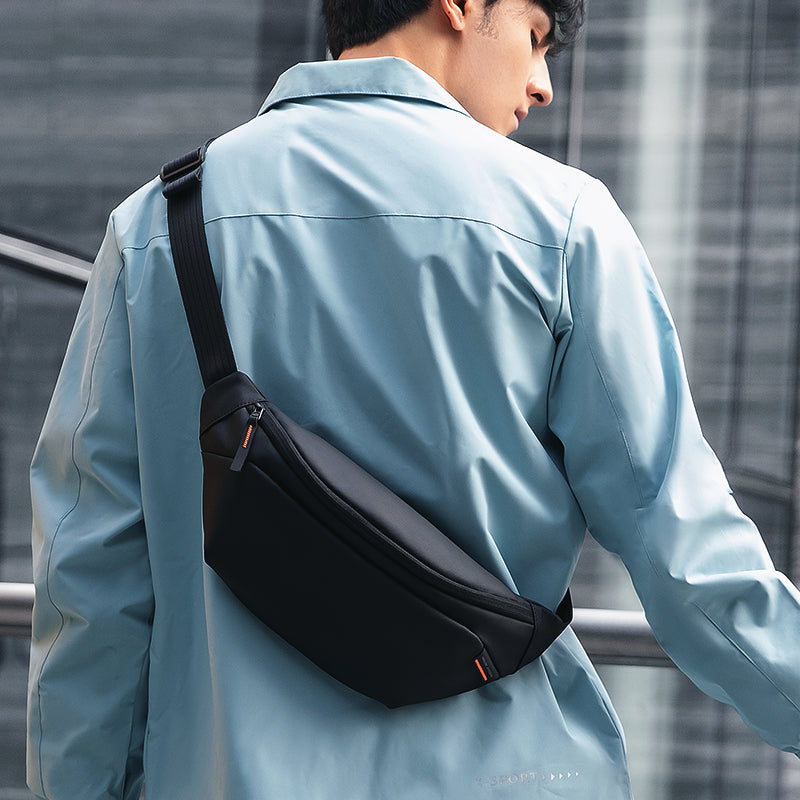 Mark Ryden Global: Sleek black daily crossbody bag with orange accent, modern style