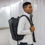 MarkRyden Global black multifunctional business backpack with YKK zipper worn by man