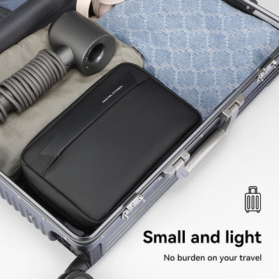 Mark Ryden black washbag in suitcase - compact travel accessory