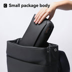 Black waterproof Switchstorage II storage bag being placed into Mark Ryden backpack - modern travel essential