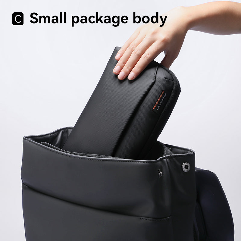 Black waterproof Switchstorage II storage bag being placed into Mark Ryden backpack - modern travel essential