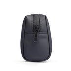 Dark gray portable traveling toiletries bag with zippered top compartment and front pocket, textured material for large capacity travel storage.