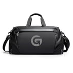 Mark Ryden black anti-theft customized travel bag with 'G' logo