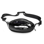 Mark Ryden black anti-theft waist bag with tech accessories inside, modern travel design
