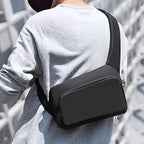 Breck Daily waterproof black crossbody bag on model - Mark Ryden Global