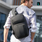 Black MARK RYDEN large capacity waterproof crossbody commuter bag worn outdoors