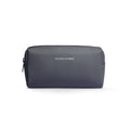Dark gray Mark Ryden portable large capacity traveling toiletries bag with textured exterior and zippered closure.