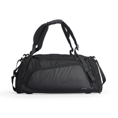 Mark Ryden Worksman black durable polyester travel bag with spacious main compartment, multiple easy access pockets, padded handles, and adjustable shoulder straps.