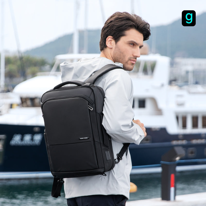 Mark Ryden Squero III black anti-theft daily backpack on man at marina
