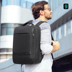 Black Mark Ryden Largy backpack: sleek design, front zip pocket, worn in urban setting—robust travel companion.