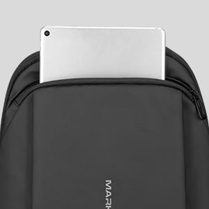 Black slim laptop backpack with silver device, MarkRyden anti-theft commuting bag