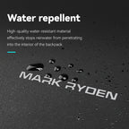 Mark Ryden Voyager Pro backpack water repelling test with water droplets on black surface