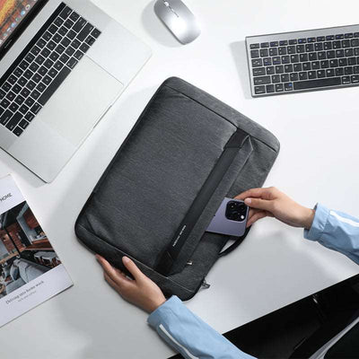 Dark gray anti-theft business laptop case with phone pocket on office desk