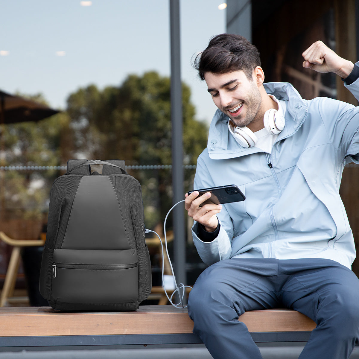 Mark Ryden Global dark gray anti-theft water-repellent backpack with USB charging, modern traveler scene