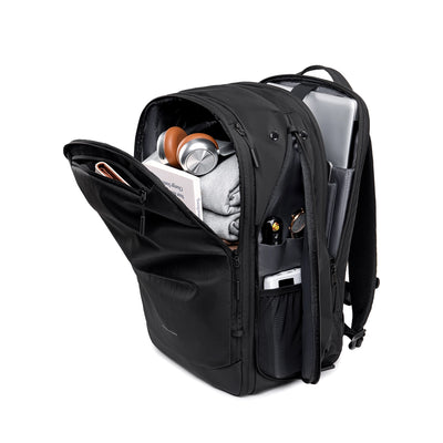 MARK RYDEN Globalist 3-in-1 tech travel backpack with 180° clamshell opening, black, showing headphones, clothes, laptop