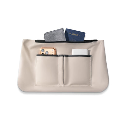 FortiCore beige anti-theft briefcase with front pockets holding passport, wallet, smartphone - Mark Ryden Global