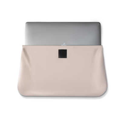 FortiCore rugged laptop briefcase in beige with silver laptop inside, black patch for secure closure, offering maximum protection and organization.