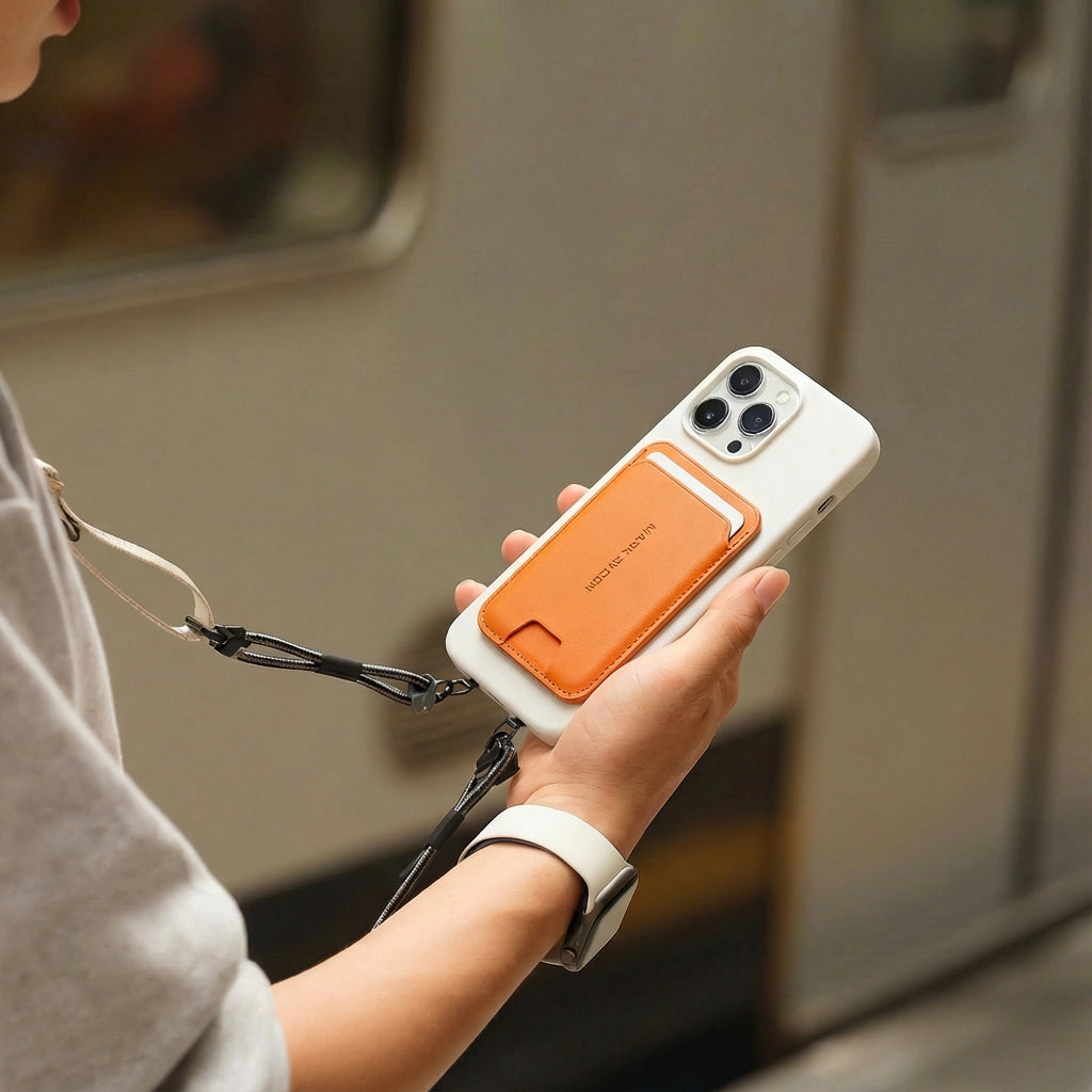 Mark Ryden Global's orange MagSafe foldable card holder wallet on white phone in transit