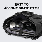 Modern traveler's black tech-integrated messenger bag with charger compartment, holding laptop & accessories – EASY TO ACCOMMODATE ITEMS