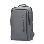 Sleek gray water-resistant MarkRyden UrbanLite Pro business travel backpack with zip pocket