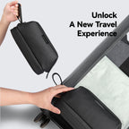 Black Switchstorage V toiletry bag with wet and dry compartments, held and placed into a suitcase for organized travel.