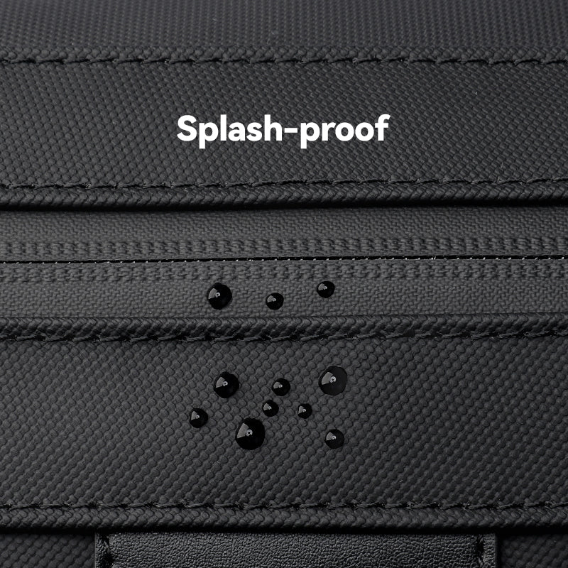 Black Switchstorage toiletry bag with water droplets showing splash-proof feature for modern travelers