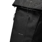 Mark Ryden MorphCore backpack with water droplets showcasing waterproof design for travelers