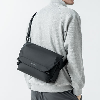 Black waterproof sling bag for urban gamers, Mark Ryden, modern style