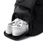 Black TransitPro duffel bag with white sneakers in compartment | MARK RYDEN Global