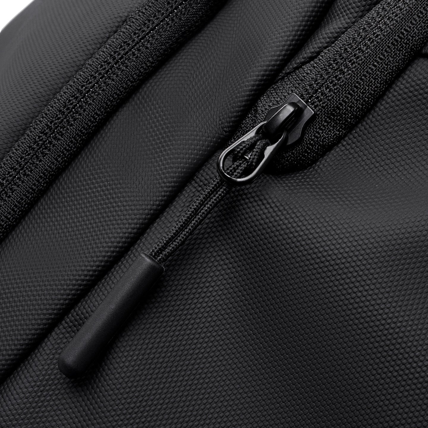 Black textured fabric zipper detail on MARK RYDEN Global TransitPro travel bag