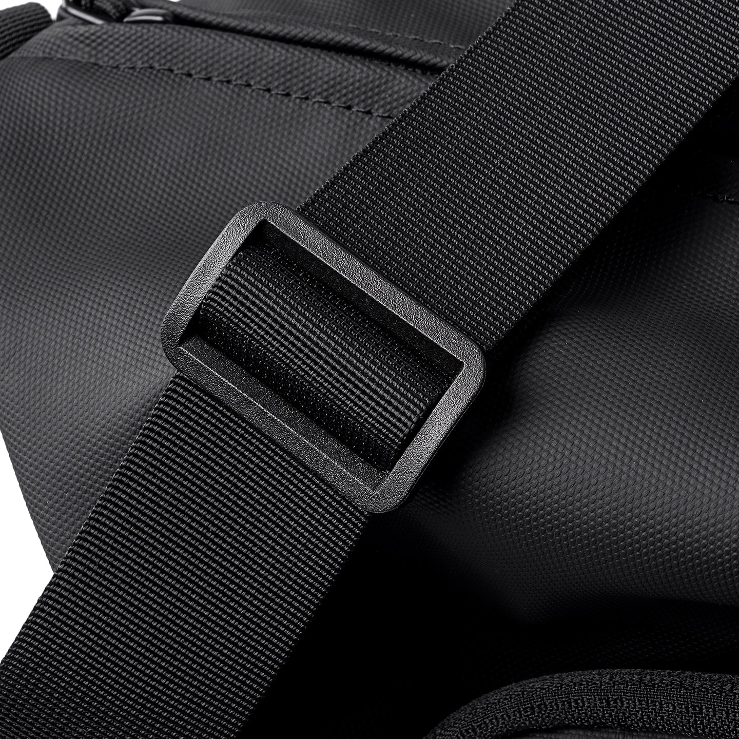 Black textured strap with buckle on MARK RYDEN TransitPro travel duffel bag