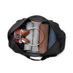 Black TransitPro duffel bag with clothes, camera, headphones - MARK RYDEN travel bag
