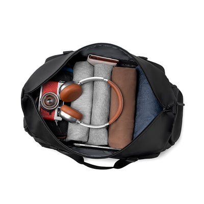 Black TransitPro duffel bag with clothes, camera, headphones - MARK RYDEN travel bag