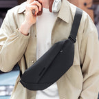 Mark Ryden RapidPack Lite: Black waterproof tri-compartment sling pack worn for daily commute