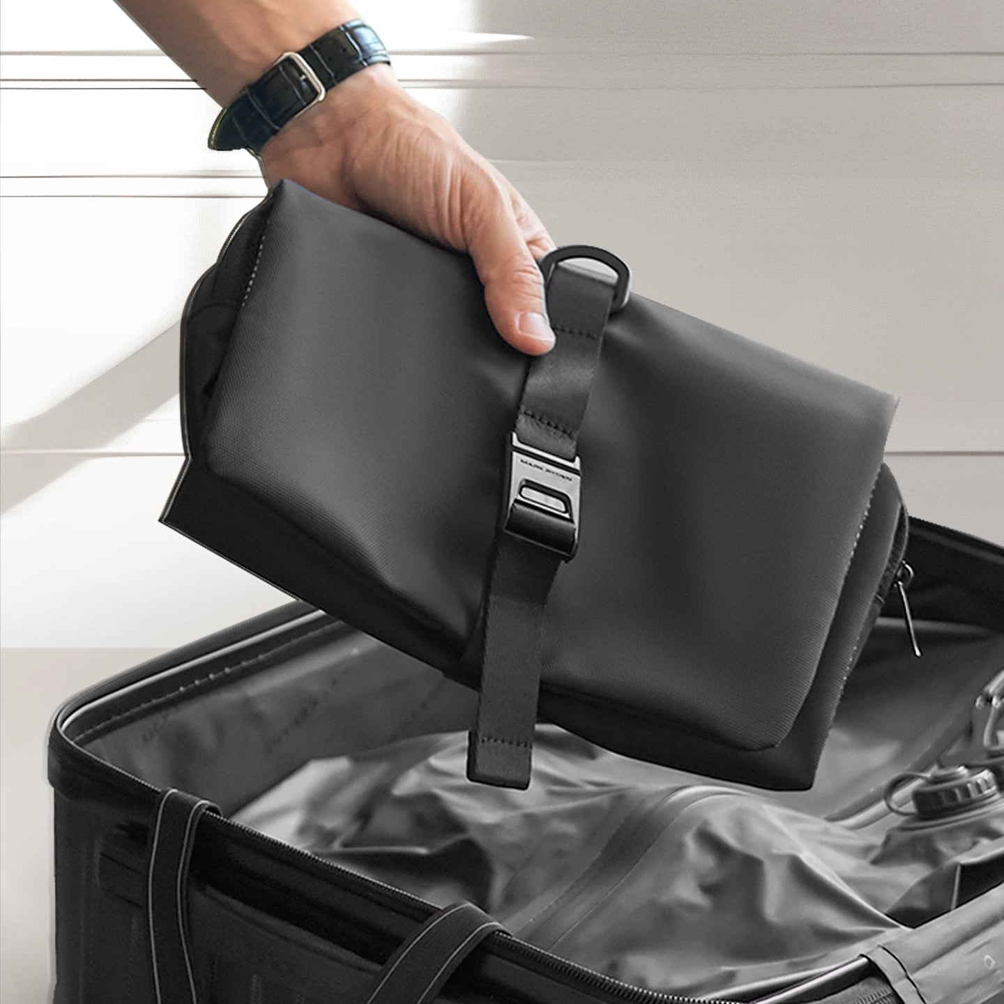 Mark Ryden Global black anti-theft toiletry bag with toothbrush holder in suitcase