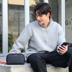 Mark Ryden Global NanoGrid precision-fit digital toolkit in sleek black, modern traveler using smartphone outdoors